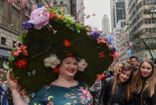 A person wears an large Easter bonnet in New York City