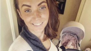 Azaria Faver rocks baby Bella to sleep