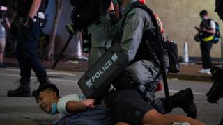 A protester is arrested in Hong Kong on 1 July 2020