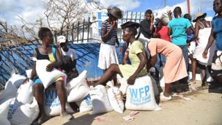 Haitian's queue for food supplies