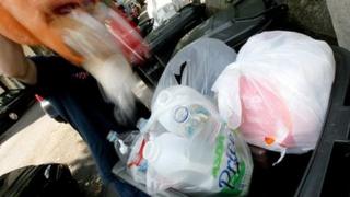 Waste being put in a bin
