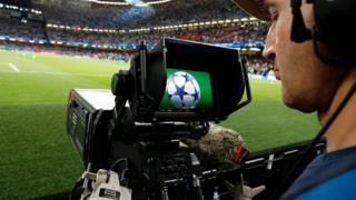 A television cameraman films proceedings before the start of the UEFA Champions League final football match between Juventus and Real Madrid at The Principality Stadium in Cardiff, south Wales, on June 3, 2017