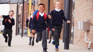 Children running out of school