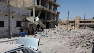 Photograph published by anti-IS activist group Raqqa is Being Slaughtered Silently (RBSS) purportedly showing aftermath of air strikes in Raqqa, Syria (22 June 2016)
