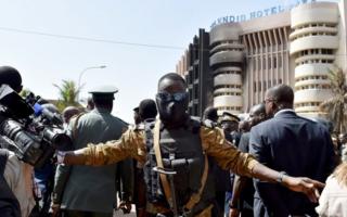 burkina security man in front of hotel