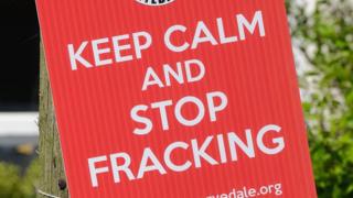 An anti-fracking placard.