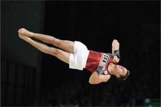 Canada's Rene Cournoyer competes in the men's team final and individual qualification in the artistic gymnastics event.