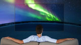 Man watching wide screen