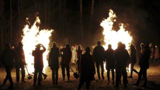 Visitors attend the Firewalking Winter Solstice event in Baltezers, Latvia, 15 December 2018