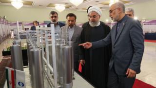 Iranian President Hassan Rouhani is shown nuclear technology by Atomic Energy Organization of Iran chief Ali Akbar Salehi in Tehran on 9 April 2019