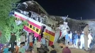 Rescuers at the site of a train crash in Odisha, eastern India
