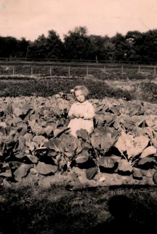 Christine Regas as a young girl on allotment