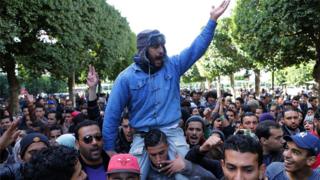 Unemployed graduates shout slogans during a demonstration urging the government to provide them with job opportunities, in Tunis, Tunisia, 21 January 2016