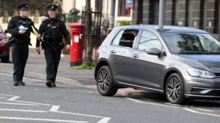 Police officers at the scene of the security alert