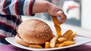 Child eats chips