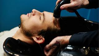 Getting hair washed in a salon