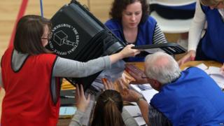 Count staff empty a ballot box