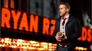 Ryan Reynolds accepts an award for his role in Deadpool
