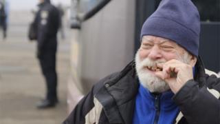 A prisoner reacts before a prisoner exchange between Ukrainian and pro-Russian rebels" sides, not far from the Maiorske checkpoint,