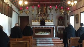 Monks praying in the chapel