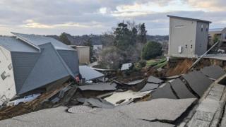 A view of a collapsed road and houses because of an earthquake in Wajima, Ishikawa prefecture, Japan January 2, 2024