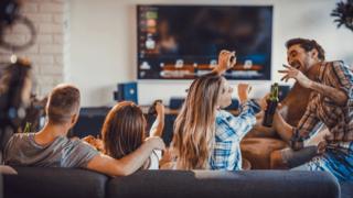 Gang of friends watching TV