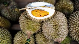 Durian fruits are displayed at a roadside shop in Karak, in the suburbs of Pahang outside Kuala Lumpur on 14 July 2015.