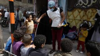 Children wait for food rations in Yemen