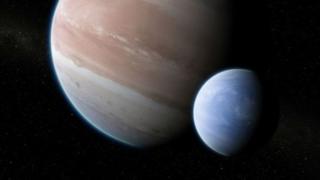 Ilustración de una planeta y una luna