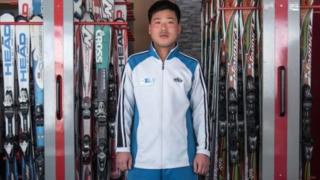 In this photo taken on February 20, 2017, Kim Chol-Nam, 30, poses for a portrait at the ski hire desk