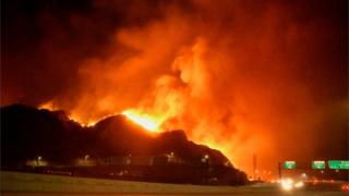 Wildfire burns in the Sylmar neighbourhood of Los Angeles