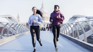 Women jogging with St Paul's in the background