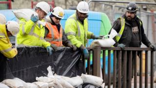 Workers construct flood defences in the Upper Calder Valley in West Yorkshire