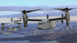 Three MV-22 Osprey aircraft flying in formation above the Pacific Ocean off the coast of Sydney, Australia, on 29 June