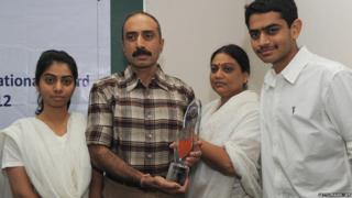IPS Sanjiv Bhatt (2L) poses with his wife Shweta (2R), daughter Aakashi (L), and son Shantanu (R) after receiving the 5th Mother Teresa Award for Social Justice in Ahmedabad on December 31, 2012.