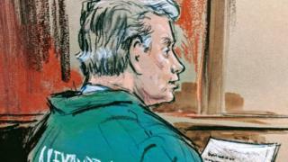 Ông Manafort hầu tòa trong bộ áo tù nhân xanh lá cây và ngồi trên xe lăn