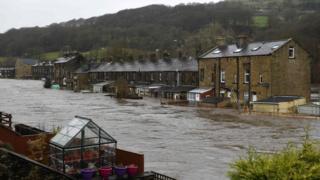 Flooded houses in Mytholmroyd, northern England, after the River Calder burst its banks