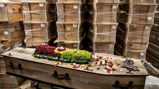 in_pictures A picture taken in a funeral house in Johannesburg, on July 26, 2020 shows coffins stacked at the warehouse. - South Africa has the highest numbers of diagnosed infections in Africa and ranks fifth in the world after the United States, Brazil, India and Russia.