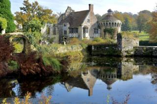 Scotney Castle reflected in water