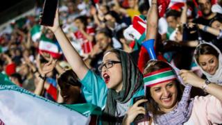 Female football fans cheering at the World Cup 2018