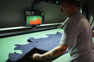A man checking leather