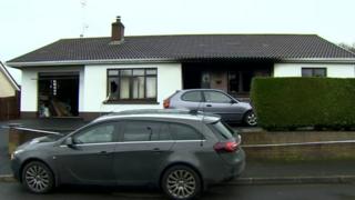 The house where the fire broke out - damage can be seen at the front of the property