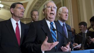Senate Majority Leader Republican Mitch McConnell (C) speaks at a news conference