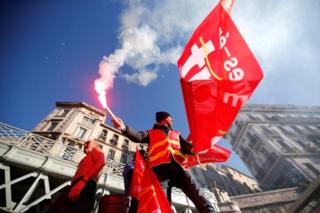 French CGT labour union workers attend a demonstration against government pension reform plans in Marseille on 10 December 2019