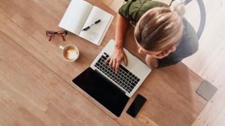 Woman working at a laptop