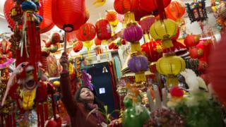 Lady selling Chinese trinkets