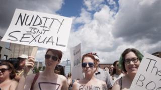 Bare With Us" demonstrators gather at the Waterloo Town Square in Waterloo, Ontario, Canada, 1 August, 2015.