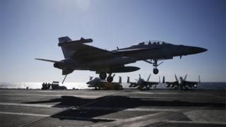 A US Navy F/A-18 Super Hornet fighter lands onto the deck of the USS Ronald Reagan, a Nimitz-class nuclear-powered super carrier, during a joint naval drill between South Korea and the US in the West Sea, South Korea, Wednesday, 28 October 2015