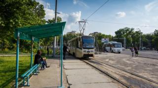 Passengers wait for a tram in Tashkent.