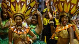 Performers from "Cape Town Carnival" of South Africa take part in the annual Lunar New Year parade in the Kowloon district of Hong Kong on February 5, 2019, to mark the Year of the Pig.